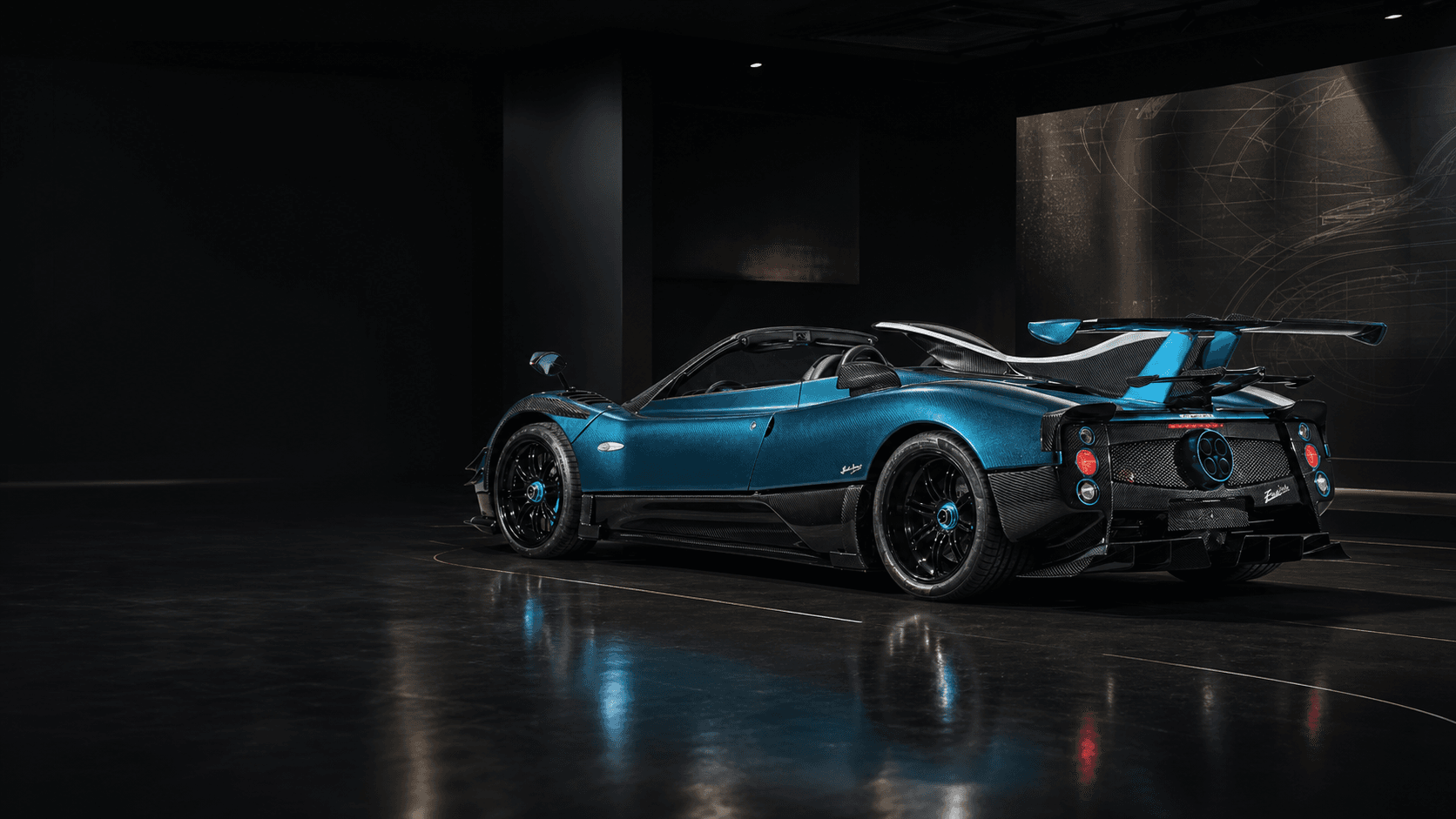 Blue Pagani Zonda Barchetta-style hypercar in a dark museum-like collector display