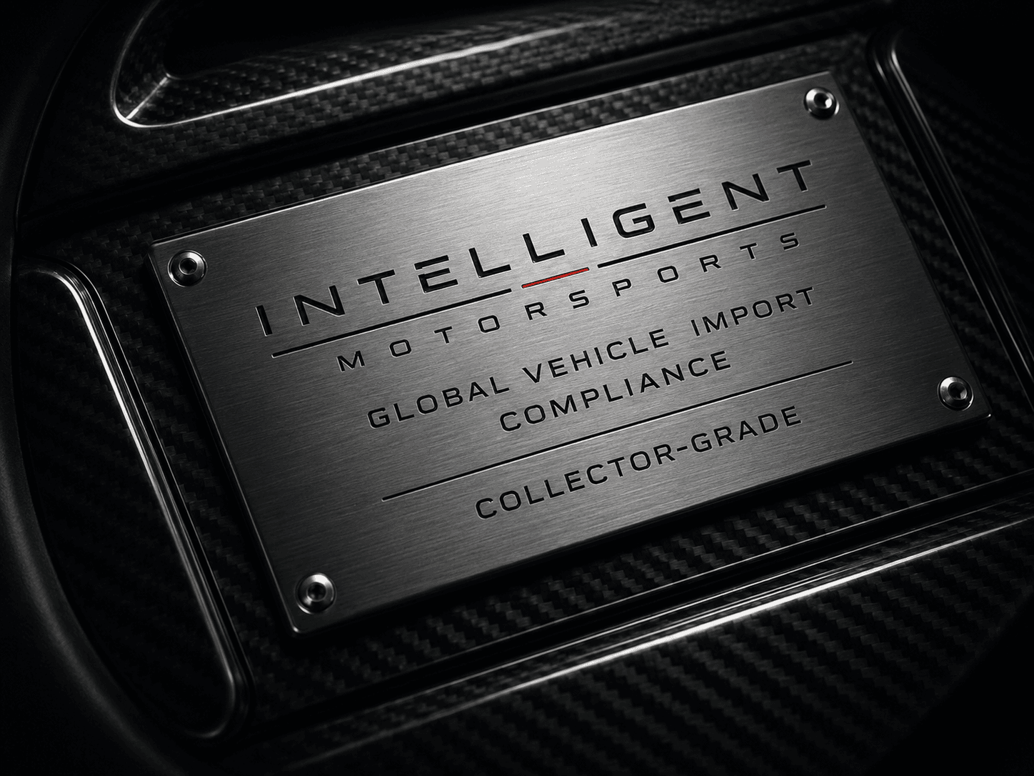 Engraved Intelligent Motorsports import and compliance badge on carbon fiber